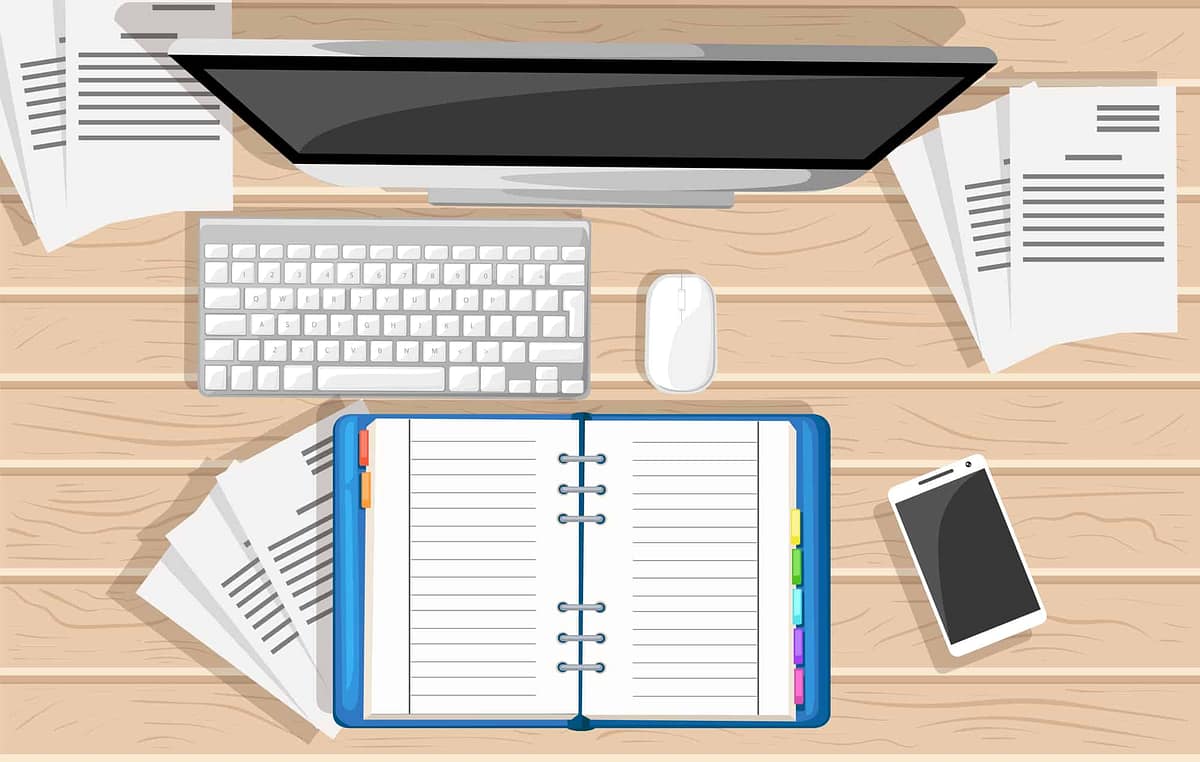 Computer and notebook on desktop